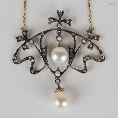 A gold, pearl and diamond pendant necklace in a scrolling design, width of pendant 4.5cm, with a