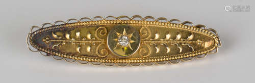 A gold and diamond single stone brooch of oval form with applied foliate wirework decoration