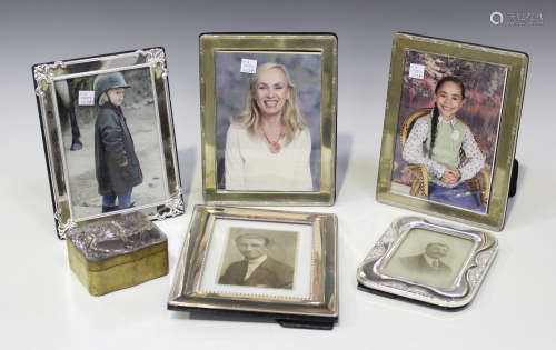 Two modern silver mounted rectangular photograph frames, each with ribbon and reed border, London