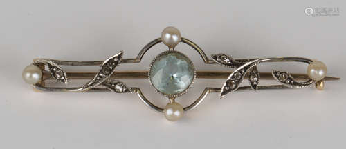 A gold, aquamarine, diamond and seed pearl brooch in an openwork design with foliate spray motifs,