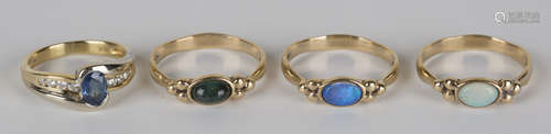 An 18ct gold, sapphire and diamond ring, mounted with an oval cut sapphire between diamond set