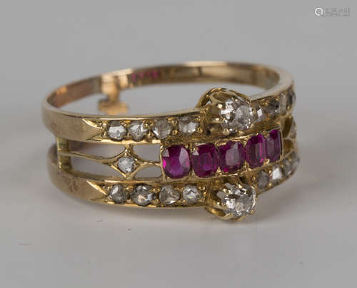 A gold, ruby and diamond ring, mounted with a row of five cushion shaped rubies, between the two