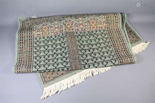 A Celadon Green Woollen Rug