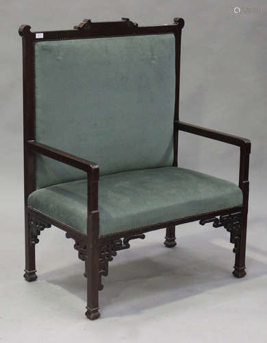 A 20th century Chinese hardwood hall seat with carved decoration, upholstered in green velour, on