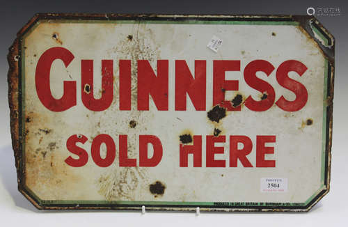 A double-sided 'Guinness Sold Here' enamelled advertising sign, marked 'Produced in Great Britain by