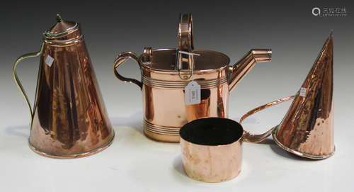 An Edwardian copper watering can, a late Victorian copper tappit lidded flagon, a copper mould and a