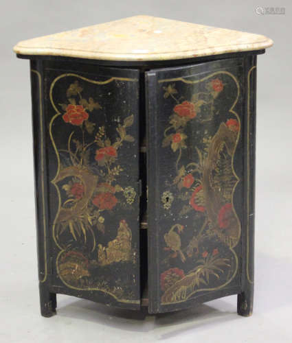 An 18th century Japanned corner cabinet, the shaped marble top above a pair of doors decorated in