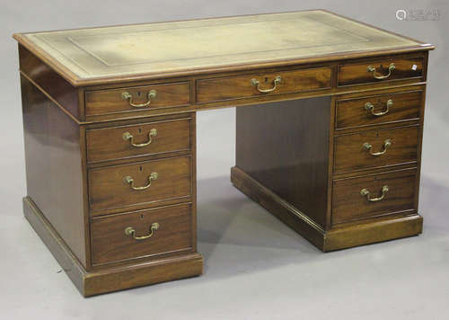 A late 20th century George III style mahogany twin pedestal desk by William Tillman, the moulded top