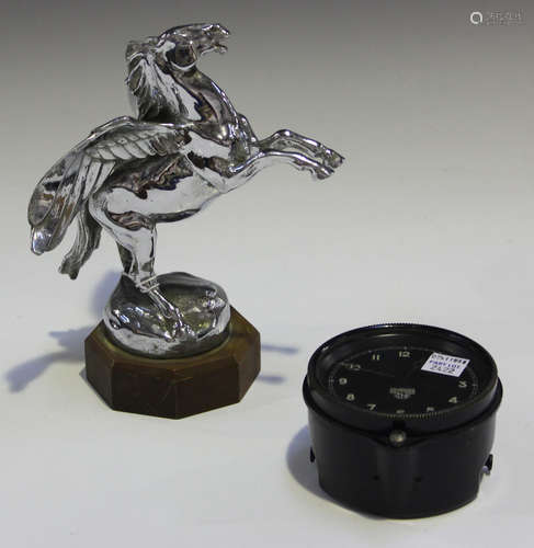 A cast metal chromium plated car mascot in the form of Pegasus, mounted on an octagonal composite