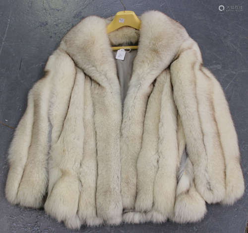 A late 20th century silver fox fur half-length lady's coat, length 73cm.Buyer’s Premium 29.4% (