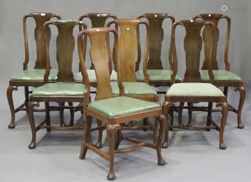A set of eight early 20th century Queen Anne style walnut vase back dining chairs with drop-in