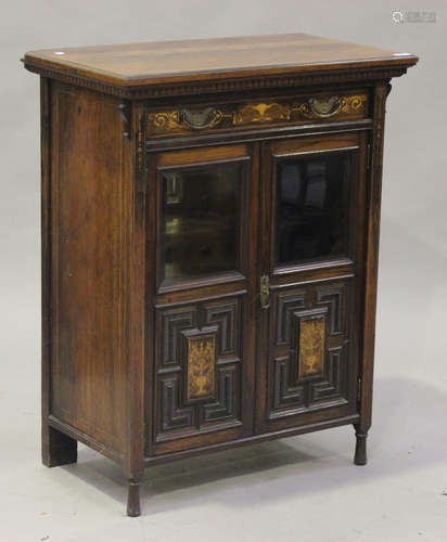 A late Victorian rosewood side cabinet with inlaid decoration, fitted with a drawer above two glazed