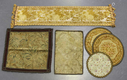 A group of mixed textiles, including early 20th century vestments, a silk embroidered panel and a