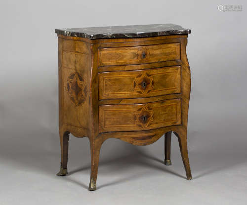 A mid-18th century Italian walnut serpentine fronted commode, the shaped marble top above four