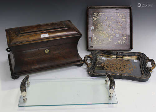 A Regency rosewood tea caddy of waisted sarcophagus form (the interior lacking one canister),