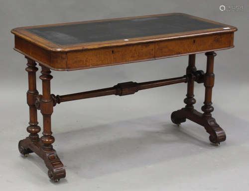 A Victorian oak library writing table, the top inset with a gilt-tooled writing surface above two