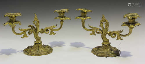 A pair of 19th century Rococo Revival cast ormolu twin light candelabra of foliate scrolling form,