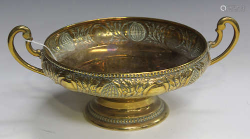 A WMF Arts and Crafts style brass twin-handled bowl, the sides decorated with a band of