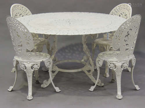 A 20th century cast metal garden suite, comprising two graduated tables, four chairs and a set of