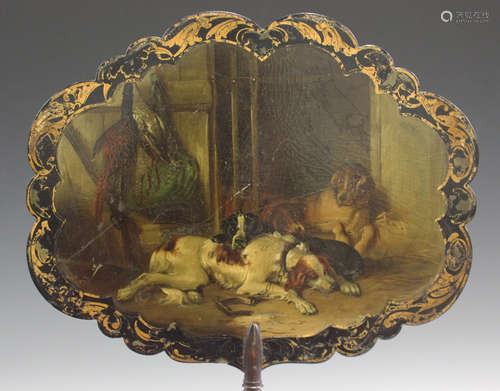 A mid-Victorian papier-mâché face screen painted in the manner of Landseer with four working dogs in