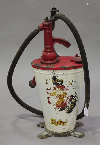 A Shell oil dispenser of tapering oval form by Baelz, fitted with a hose and winding handle,