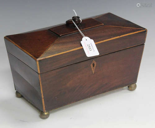 An early 19th century mahogany and boxwood banded tea caddy of sarcophagus form, width 33cm.Buyer’