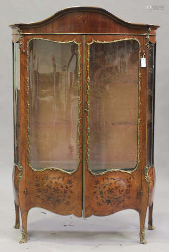 A late 19th century French Louis XV style kingwood and gilt metal mounted two door vitrine, the