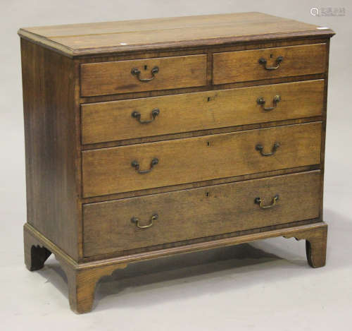 A George III oak chest of two short and three long drawers, on bracket feet, height 90cm, width