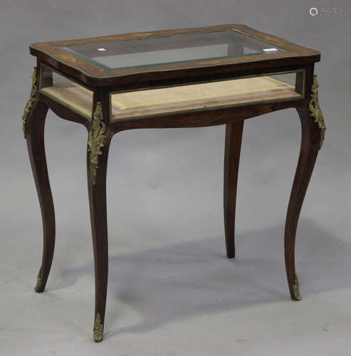 A late 19th century rosewood bijouterie table with inlaid decoration, the bevelled glass top above