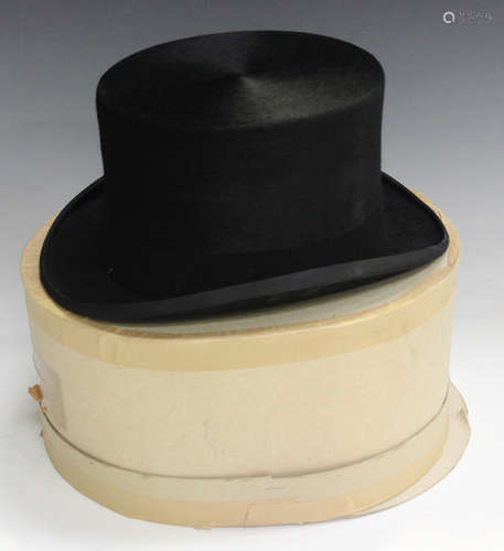 A black moleskin top hat by Bates, London, size 7¼, 59.Buyer’s Premium 29.4% (including VAT @ 20%)