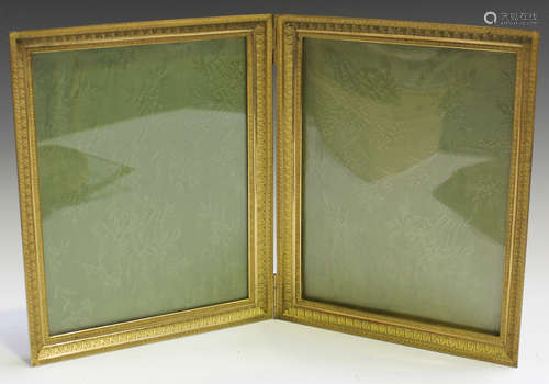 A late 19th/early 20th century French cast ormolu hinged double frame, decorated with overall