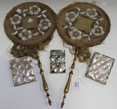 A pair of late Victorian beadwork face screens with giltwood handles, length 46cm, together with