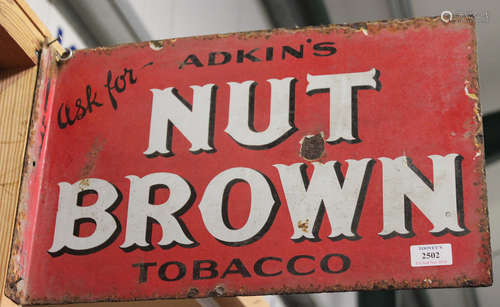 A double-sided 'Adkin's Nut Brown Tobacco' enamelled advertising wall sign, 30.5cm x 47cm.Buyer’s