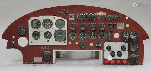 An Air Ministry instrument panel from a Lancaster bomber, fitted with ignition switches, r.p.m.