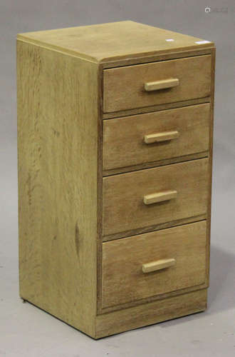 An Art Deco Rowley Gallery oak chest of four graduated drawers with angular handles, bearing maker's