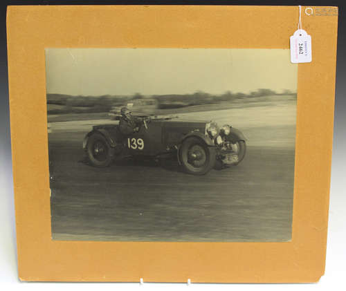 A black and white photograph of a 1930s 1.5ltr Aston Martin, Number 139, detailed 'Photo - Guy