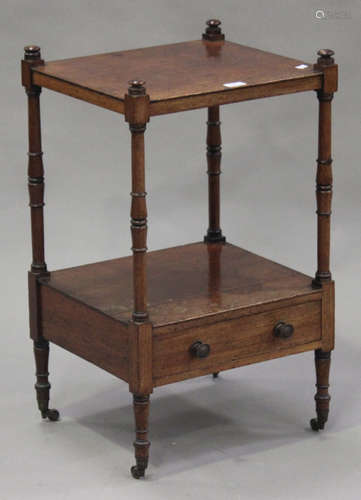 A 19th century mahogany two-tier whatnot with turned supports and a drawer, on brass castors, height