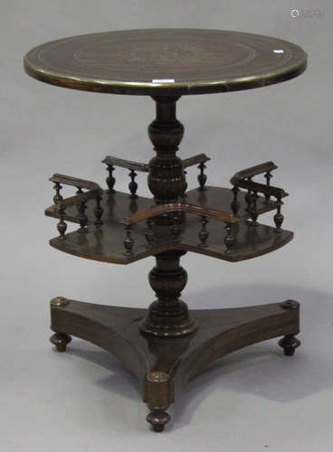 A 19th walnut and brass inlaid circular occasional table, the turned column with a rotating shelf,