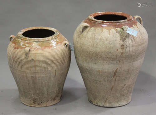 Two 20th century Continental terracotta garden olive jars, each ovoid body with applied loop