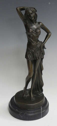 F. Rude - a late 20th century brown patinated cast bronze figure of a standing lady holding a drape,