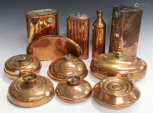 A collection of late 19th and early 20th century copper carriage, coach and automobile hot water