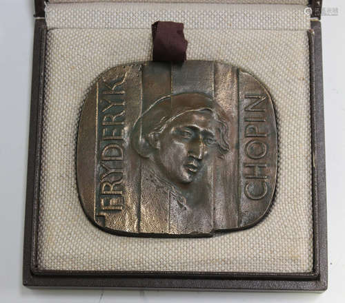 A late 20th century brown patinated cast bronze commemorative medallion, one side depicting the