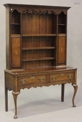 A 19th century oak and chequer inlaid dresser, the shelf back with pierced frieze and two cupboards,