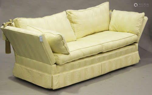 A modern Knole style settee, upholstered in foliate patterned cream damask, height 82cm, width