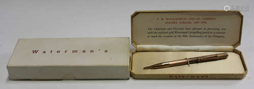 A 9ct gold cased propelling pencil with engine turned decoration, with a Waterman's case, box and