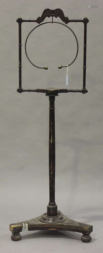 A Regency mahogany bird perch stand, the turned frame supporting a brass circular perch, fitted with