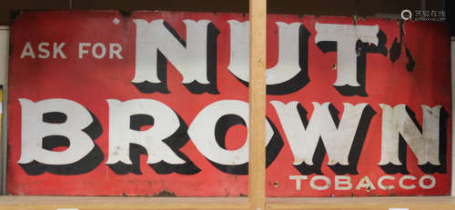 A large 'Nut Brown Tobacco' enamelled advertising sign, 66cm x 169cm.Buyer’s Premium 29.4% (