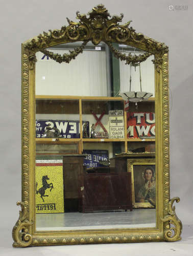 A 19th century French giltwood and composition overmantel mirror with scroll surmount above floral