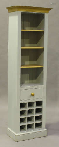 A modern painted pine and oak narrow display shelf, fitted with a drawer and a twelve bottle wine