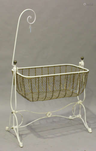 A Victorian white painted wrought metal and brass child's crib, height 165cm, width 108cm, depth